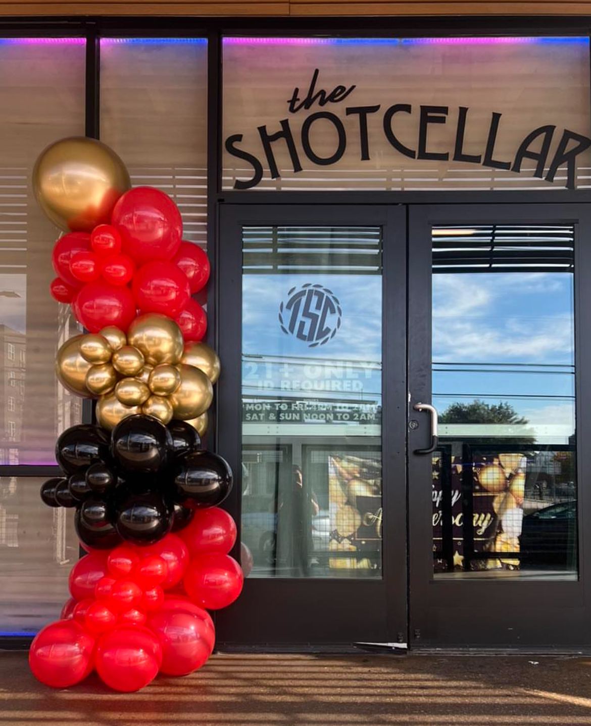 The Shot Cellar storefront on Foch Street in daylight